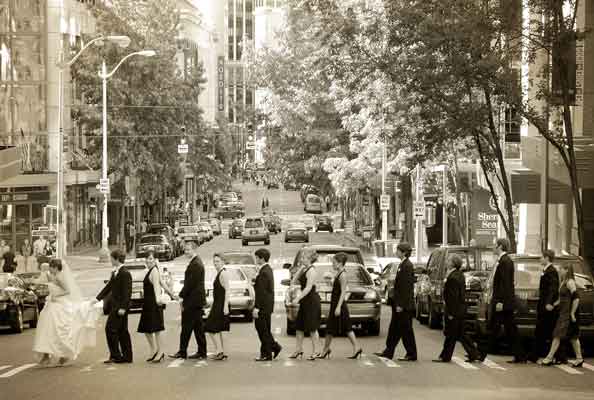 Wedding party crossing street